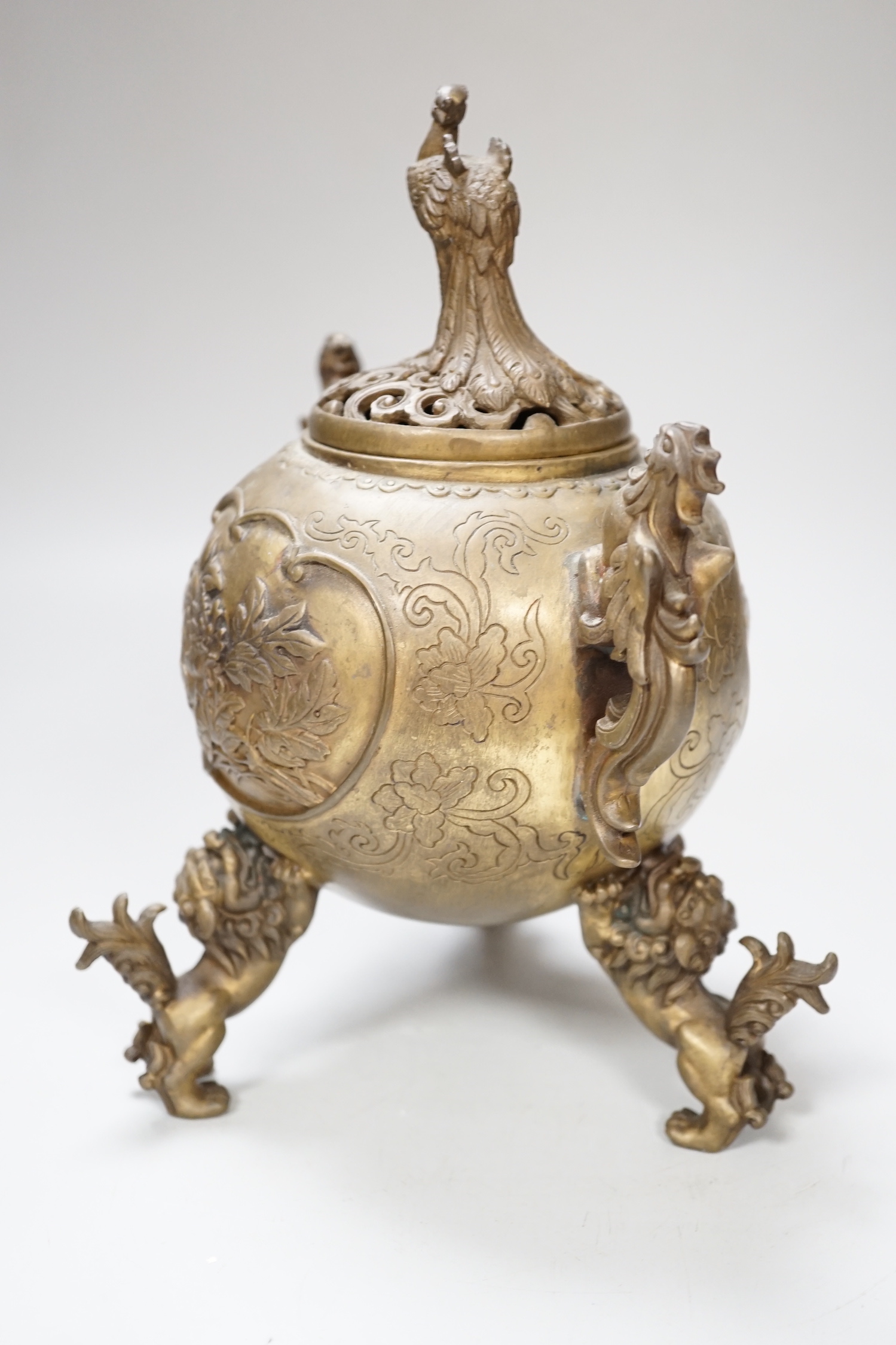 A Japanese bronze shi-shi footed censer and cover, 22cm high